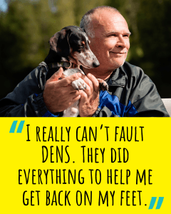 A man holding his dog