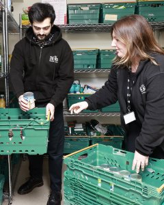 DENS staff sorting food items